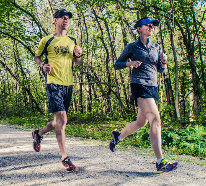 two runners out on a gravel path