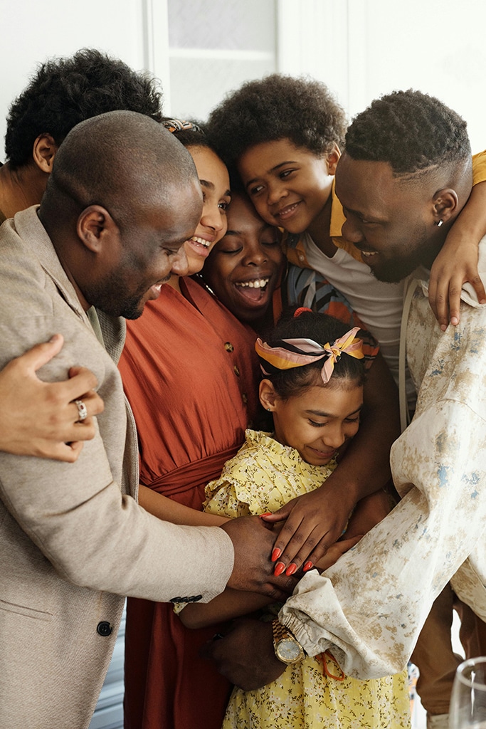 loving family hugging each other tightly
