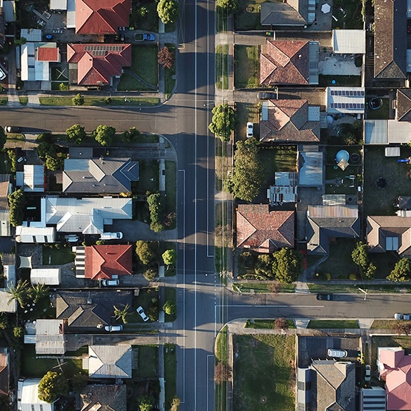 Top down arial view of a city streets and housing